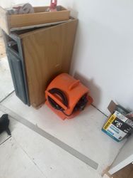 Air Movers Deployed for Drying — Multiple commercial air movers deployed in a structural drying setup — calculated CFM ensures Class 2 drying schedule is met.
