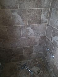 Panama City Bathroom Tile Restoration — Bathroom tile restoration in a Panama City home — water-damaged tile demoed, subfloor dried, and new tile installed.