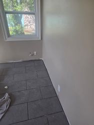 Tile Floor Room Restoration — Restored room with new tile floor after a complete water damage restoration and rebuild project.