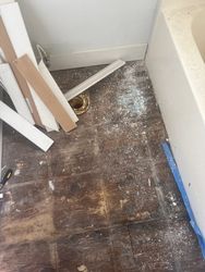 Panama City Floor Water Damage — Panama City water damage floor restoration in progress — saturated flooring removed, subfloor exposed for drying.